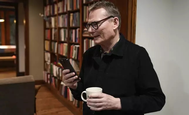 Nobel prize winner in Economics, James A. Robinson, gives an interview to the Associated Press from his home in the Hyde Park neighborhood of Chicago, Monday, Oct. 14, 2024. (AP Photo/Charles Rex Arbogast)