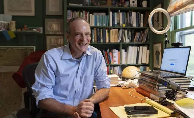 Economist Simon Johnson poses for a photograph after jointly winning the Nobel memorial prize in economics, at his home in Washington, Monday, Oct. 14, 2024. (AP Photo/Ben Curtis)