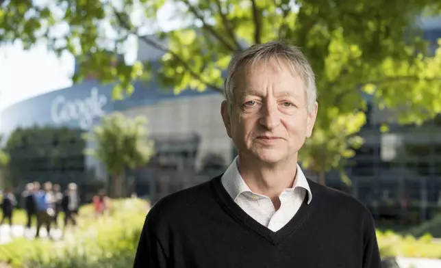 FILE - Computer scientist Geoffrey Hinton, who studies neural networks used in artificial intelligence applications, poses at Google's Mountain View, Calif, headquarters on Wednesday, March 25, 2015. (AP Photo/Noah Berger, File)