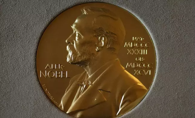 FILE - A Nobel Prize medal is displayed before a ceremony at the Swedish Ambassador's Residence in London, Monday, Dec. 6, 2021. (AP Photo/Matt Dunham, File)