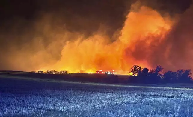 In this photo provided by the Arnegard Fire Protection District, a wildfire burn near Arnegard, N.D., Saturday, Oct. 5, 2024. (Arnegard Fire Protection District via AP)