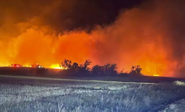 In this photo provided by the Arnegard Fire Protection District, a wildfire burn near Arnegard, N.D., Saturday, Oct. 5, 2024. (Arnegard Fire Protection District via AP)