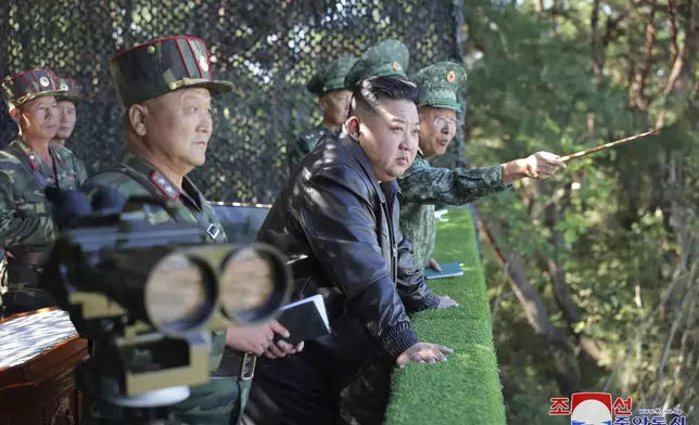 In this photo provided by the North Korean government, North Korean leader Kim Jong Un, center, visits a special operation forces unit at a western district in North Korea Wednesday, Oct. 2, 2024. Independent journalists were not given access to cover the event depicted in this image distributed by the North Korean government. The content of this image is as provided and cannot be independently verified. Korean language watermark on image as provided by source reads: "KCNA" which is the abbreviation for Korean Central News Agency. (Korean Central News Agency/Korea News Service via AP)