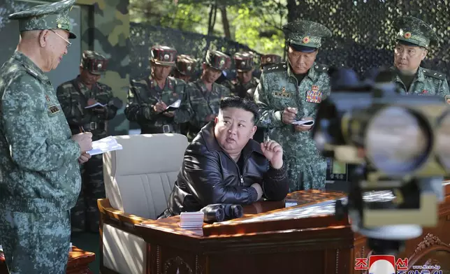 In this photo provided by the North Korean government, North Korean leader Kim Jong Un, center, visits a special operation forces unit at a western district in North Korea Wednesday, Oct. 2, 2024. Independent journalists were not given access to cover the event depicted in this image distributed by the North Korean government. The content of this image is as provided and cannot be independently verified. Korean language watermark on image as provided by source reads: "KCNA" which is the abbreviation for Korean Central News Agency. (Korean Central News Agency/Korea News Service via AP)