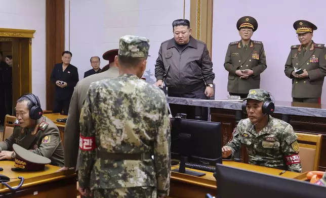 In this photo provided by the North Korean government, North Korean leader Kim Jong Un, center, visits the headquarters of the North Korean People’s Army’s 2nd Corps at an undisclosed place in North Korea Thursday, Oct. 17, 2024. Independent journalists were not given access to cover the event depicted in this image distributed by the North Korean government. The content of this image is as provided and cannot be independently verified. 8(Korean Central News Agency/Korea News Service via AP)