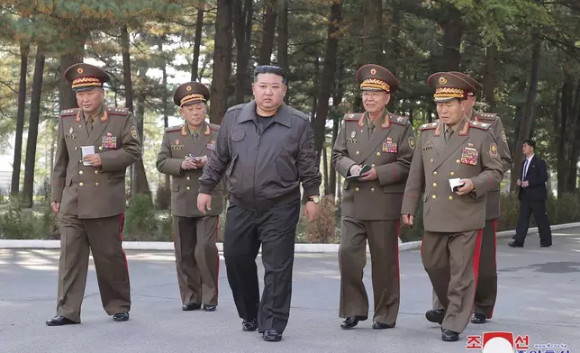 In this photo provided by the North Korean government, North Korean leader Kim Jong Un, center, visits the headquarters of the North Korean People’s Army’s 2nd Corps at an undisclosed place in North Korea Thursday, Oct. 17, 2024. Independent journalists were not given access to cover the event depicted in this image distributed by the North Korean government. The content of this image is as provided and cannot be independently verified. Korean language watermark on image as provided by source reads: "KCNA" which is the abbreviation for Korean Central News Agency. (Korean Central News Agency/Korea News Service via AP)