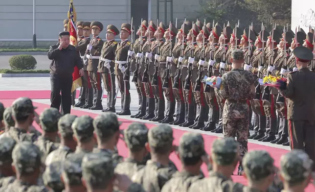 In this photo provided by the North Korean government, North Korean leader Kim Jong Un, left on red carpet, visits the headquarters of the North Korean People’s Army’s 2nd Corps at an undisclosed place in North Korea Thursday, Oct. 17, 2024. Independent journalists were not given access to cover the event depicted in this image distributed by the North Korean government. The content of this image is as provided and cannot be independently verified. (Korean Central News Agency/Korea News Service via AP)