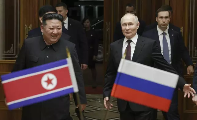 FILE - Russian President Vladimir Putin, right, and North Korea's leader Kim Jong Un smile during their meeting at the Pyongyang Sunan International Airport outside Pyongyang, North Korea, on June 19, 2024. (Gavriil Grigorov, Sputnik, Kremlin Pool Photo via AP, File)