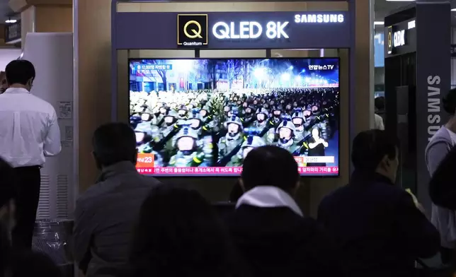 A TV screen shows file images of North Korean soldiers during a news program at Seoul Railway Station in Seoul, South Korea, Friday, Oct. 18, 2024. (AP Photo/Ahn Young-joon)