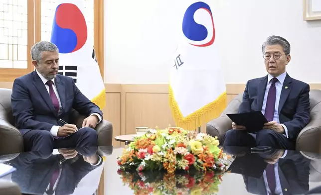 In this photo provided by South Korea Foreign Ministry, South Korea's Vice Foreign Minister Kim Hong Kyun, right, meets with Russian Ambassador to South Korea Georgy Zinoviev at the Foreign Ministry in Seoul, South Korea, Monday, Oct. 21, 2024. (South Korea Foreign Ministry via AP)