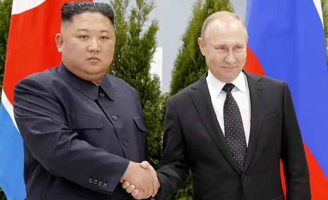 FILE - Russian President Vladimir Putin, right, and North Korea's leader Kim Jong Un shake hands during their meeting in Vladivostok, Russia, on April 25, 2019. (AP Photo/Alexander Zemlianichenko, Pool, File)