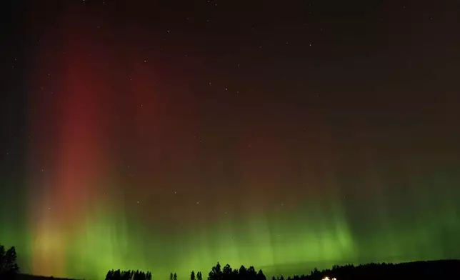 An aurora borealis, also known as the northern lights, is seen in the night sky along with the Big Dipper constellation on Thursday, Oct. 10, 2024, in Moscow, Idaho. (AP Photo/Ted S. Warren)