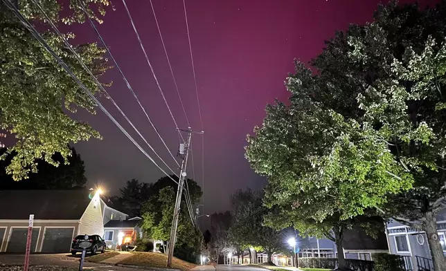 An aurora borealis, also known as the northern lights, shines over Portsmouth, N.H., Thursday, Oct. 10, 2024. (AP Photo/Caleb Jones)