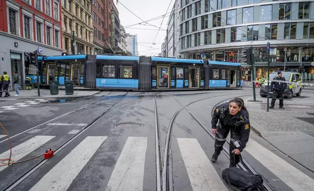 A derailed tram that crashed into a building in downtown Oslo, Norway, Tuesday Oct. 29, 2024. (Terje Pedersen/NTB Scanpix via AP)