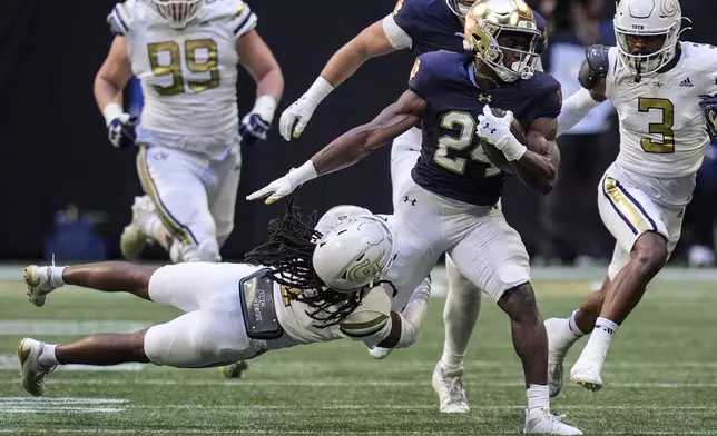 Notre Dame running back Jadarian Price (24) runs against Georgia Tech during the first half of an NCAA college football game, Saturday, Oct. 19, 2024, in Atlanta. (AP Photo/Mike Stewart)