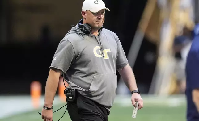 Georgia Tech head coach Brent Key ealks on the field during the first half of an NCAA college football game against Notre Dame, Saturday, Oct. 19, 2024, in Atlanta. (AP Photo/Mike Stewart)