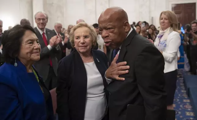 FILE - From left, Dolores Huerta, labor leader and civil rights activist, Ethel Kennedy, and civil rights leader Rep. John Lewis, D-Ga., are applauded during the Robert F. Kennedy Human Rights Award ceremony on Capitol Hill in Washington, Tuesday, June 5, 2018. (AP Photo/J. Scott Applewhite, File)