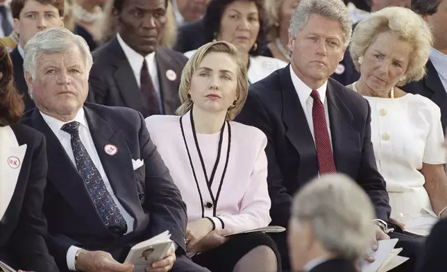 FILE - Sen. Edward Kennedy, from left, first lady Hillary Rodham Clinton, President Bill Clinton and Ethel Kennedy, right, listen to a remembrance delivered by Rep. Joseph P. Kennedy II during a memorial Mass in honor of Robert F. Kennedy on the 25th anniversary of his death at the Arlington National Cemetery in Arlington, Va., June 7, 1993. (AP Photo/Marcy Nighswander, File)