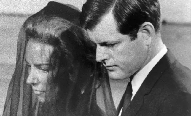 FILE - Mrs. Ethel Kennedy is escorted by her brother-in-law, Senator Edward Kennedy, to their pew in St. Patrick's Cathedral in New York for the funeral services of Sen. Robert F. Kennedy, June 8, 1968. (AP Photo/File)