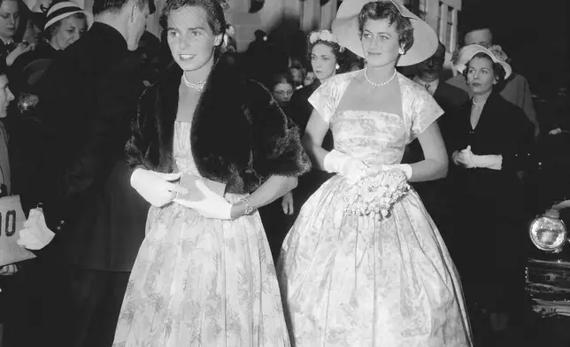 FILE - Mrs. Robert F. Kennedy, left, and Jean Kennedy, sister-in-law and sister, respectively of Patricia Kennedy, enter the Roman Catholic Church of St. Thomas More in New York, April 24, 1954, to attend Patricias wedding to actor Peter Lawford. Ethel Kennedy is at left. (AP Photo/Matty Zimmerman, File)