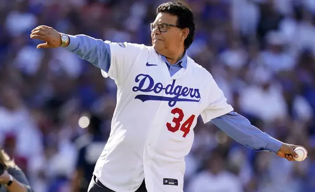 FILE - Former Los Angeles Dodgers pitcher Fernando Valenzuela throws the ceremonial first pitch during the MLB All-Star baseball game, July 19, 2022, in Los Angeles. Fernando Valenzuela, the Mexican-born phenom for the Los Angeles Dodgers who inspired “Fernandomania” while winning the NL Cy Young Award and Rookie of the Year in 1981, has died Tuesday, Oct. 22, 2024.(AP Photo/Abbie Parr, File)