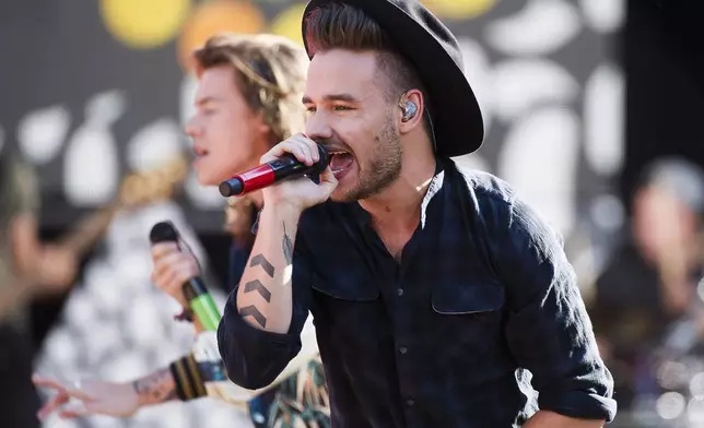 FILE - One Direction members, from right, Liam Payne and Harry Styles perform on ABC's "Good Morning America" at Rumsey Playfield/SummerStage on Tuesday, Aug. 4, 2015, in New York. (Photo by Charles Sykes/Invision/AP, File)