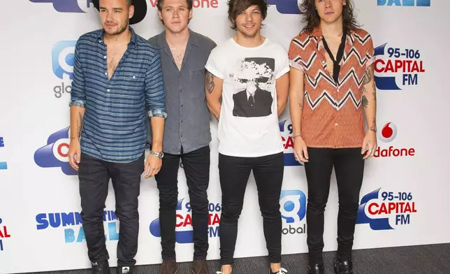 FILE - One Direction's Liam Payne, from left, Niall Horan, Louis Tomlinson and Harry Styles pose backstage at the Capital FM Summertime Ball held at Wembley Stadium, in London, on June 6, 2015. (Dominic Lipinski/PA via AP, File)