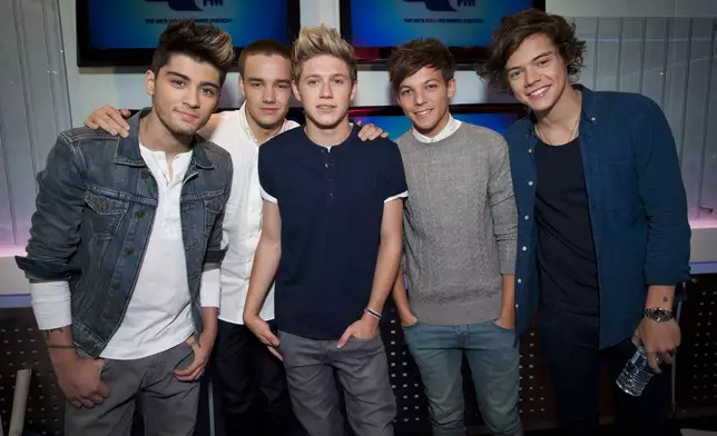 FILE - One Direction's Zayn Malik, from left, Liam Payne, Niall Horan, Louis Tomlinson and Harry Styles pictured during an interview on Capital Breakfast with Dave Berry and Lisa Snowdon, in their studios in Leicester Square, in London, on Friday, Oct. 5, 2012. (Yui Mok/PA via AP, File)