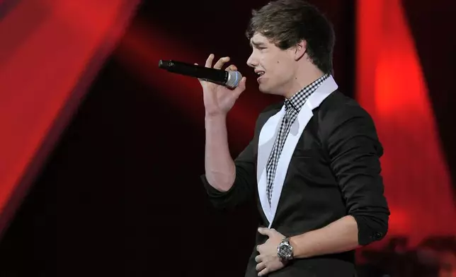 FILE - Liam Payne, of musical group One Direction, performs at Nickelodeon's 25th annual Kids' Choice Awards, March 31, 2012, in Los Angeles. (AP Photo/Chris Pizzello, File)