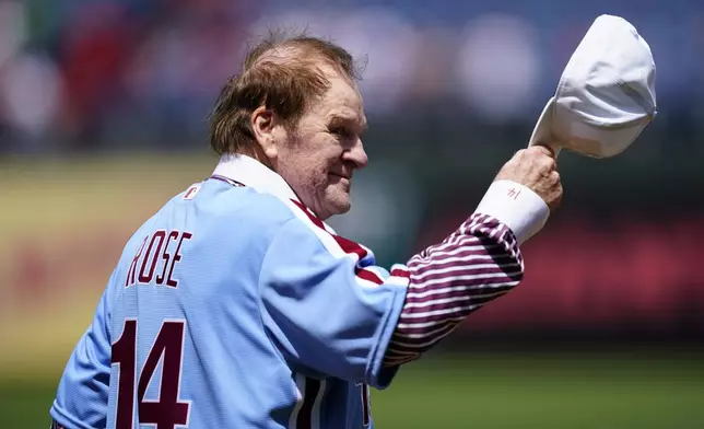 FILE - Former Philadelphia Phillies player Pete Rose tips his hat to fans during an alumni day, Aug. 7, 2022, in Philadelphia. (AP Photo/Matt Rourke, File)