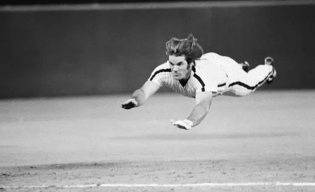 FILE - Philadelphia Phillies' Pete Rose slides to third base during a baseball game against the New York Mets in Philadelphia, June 3, 1981. (AP Photo/Rusty Kennedy, File)