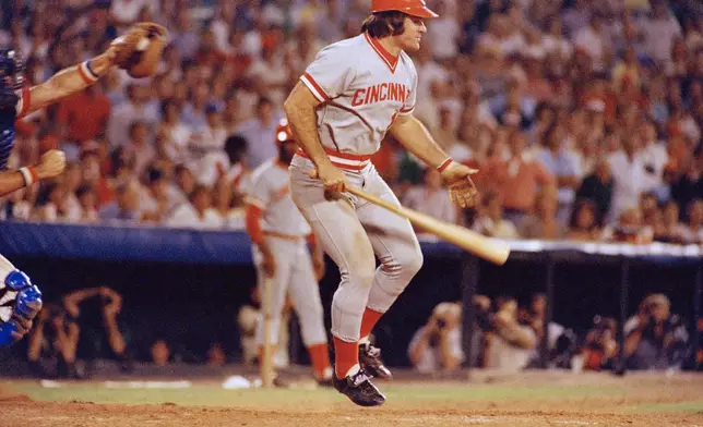 FILE - Pete Rose of the Cincinnati Reds in action at the bat against the Atlanta Braves in Atlanta, Aug. 2, 1978. At left is Atlanta catcher Joe Nolan. (AP Photo, File)