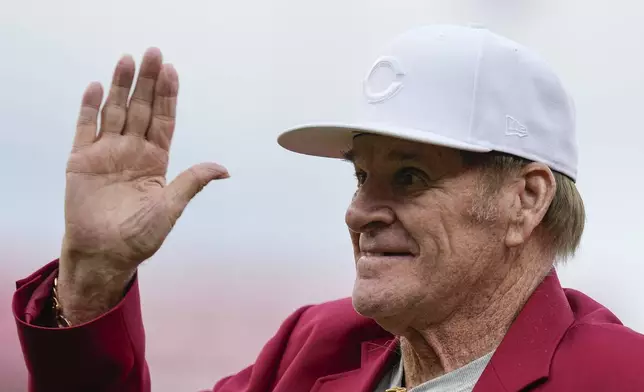 FILE - Former Cincinnati Reds player Pete Rose waves to fans after being introduced during the Reds Hall of Fame Induction Ceremony, July 15, 2023, in Cincinnati. (AP Photo/Darron Cummings, File)