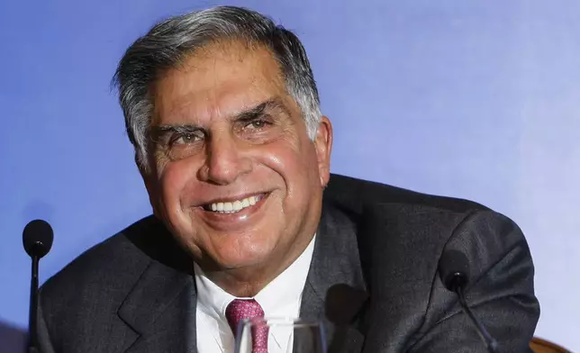 FILE - Tata Sons Chairman Ratan Tata reacts as he speaks during a press conference prior to the launch event of the Tata Nano in Mumbai, India, March 23, 2009. (AP Photo/Gautam Singh, File)