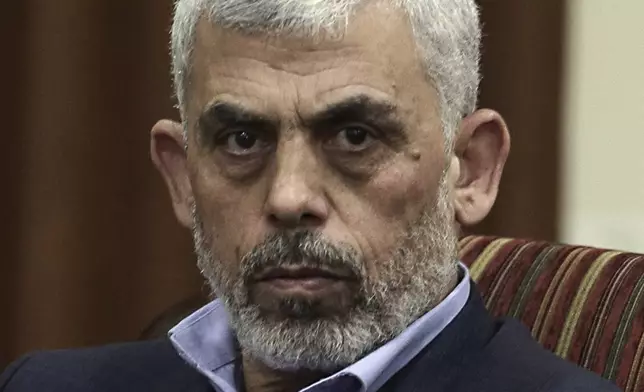 FILE - Hamas leader in the Gaza Strip Yahya Sinwar takes part in a meeting with Egypt's general intelligence chief, Khaled Fawzy and others in Gaza City, on Oct. 3, 2017.(AP Photo/ Khalil Hamra, File)