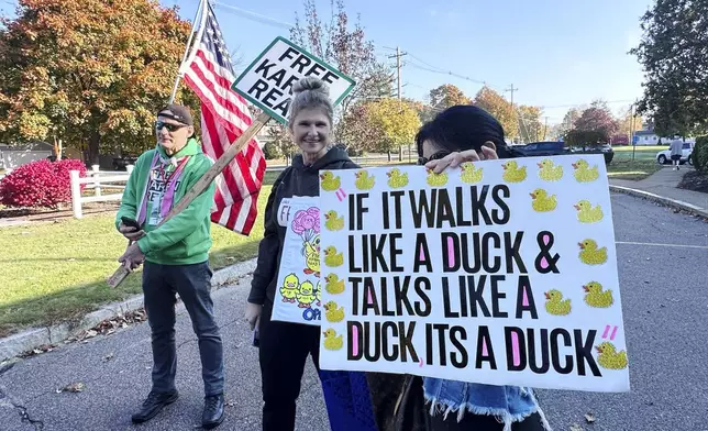 Supporters of Richard Schiffer Jr., who faces witness intimidation and other charges related to the Karen Read case, stand outside Stoughton District Court before Schiffer's arraignment, Wednesday, Oct. 23, 2024 in Stoughton, Mass. (AP Photo/Michael Casey)