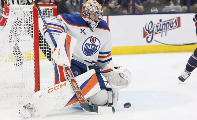 Edmonton Oilers' Stuart Skinner makes a save against the Columbus Blue Jackets during the second period of an NHL hockey game Monday, Oct. 28, 2024, in Columbus, Ohio. (AP Photo/Jay LaPrete)