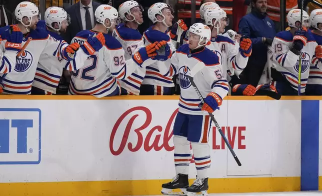 Edmonton Oilers center Jeff Skinner (53) celebrates his goal with teammates during the second period of an NHL hockey game against the Nashville Predators, Thursday, Oct. 17, 2024, in Nashville, Tenn. (AP Photo/George Walker IV)