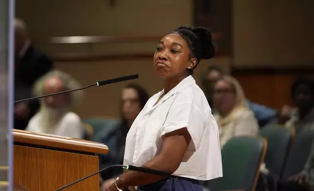 Simone Haley, granddaughter of Oretha Castle Haley, speaks during a city council hearing regarding the dispute over her grandmother's former home and plans by others to create a museum, in New Orleans, Thursday, Oct. 24, 2024. (AP Photo/Gerald Herbert)