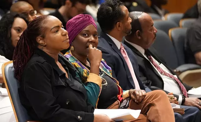 Candice Henderson-Chandler, second left, property owner of the home of former civil rights leader Oretha Castle Haley, listens during a city council hearing regarding her plans to open a museum, opposed by Oretha Castle Haley's family, in New Orleans, Thursday, Oct. 24, 2024. (AP Photo/Gerald Herbert)