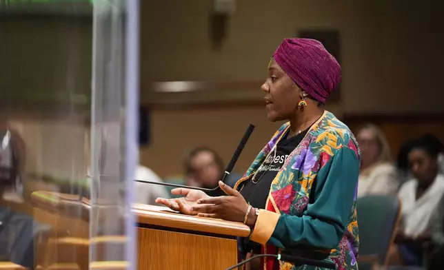 Candice Henderson-Chandler, who purchased the former home of civil rights leader Oretha Castle Haley and plans to open a museum, speaks during a city council hearing on the matter, which is opposed by Castle Haley's family, in New Orleans, Thursday, Oct. 24, 2024. (AP Photo/Gerald Herbert)