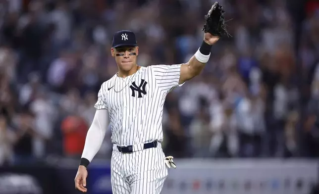 Aaron Judge waves to fans after the New York Yankees clinched the American League East title, Thursday, Sept. 26, 2024, in New York. (AP Photo/Noah K. Murray)