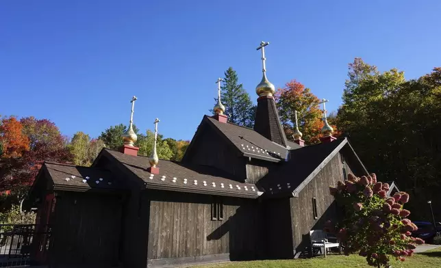 The Church of Holy Transfiguration, built by monks in 1970, stands on the campus of New Skete, a Christian Orthodox monastery renowned for dog breeding and training programs outside Cambridge, N.Y., on Oct. 12, 2024. (AP Photo/Giovanna Dell’Orto)