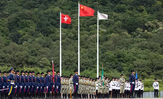 Security Bureau holds parade by disciplined services and youth groups and fun day in celebration of National Day  Source: HKSAR Government Press Releases