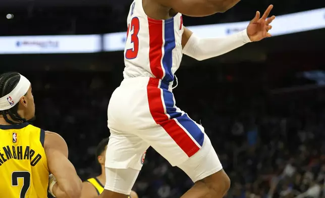 Detroit Pistons guard Jaden Ivey goes to the basket past Indiana Pacers guard Andrew Nembhard (2) during the first half of an NBA basketball game Wednesday, Oct. 23, 2024, in Detroit. (AP Photo/Duane Burleson)