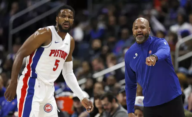 Detroit Pistons head coach J.B. Bickerstaff, right, directs guard Malik Beasley (5) during the first half of an NBA basketball game against the Indiana Pacers Wednesday, Oct. 23, 2024, in Detroit. (AP Photo/Duane Burleson)