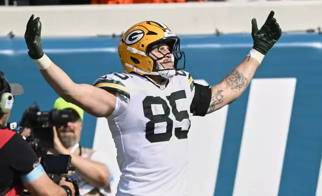 Green Bay Packers' Tucker Kraft celebrates his touchdown catch during the second half of an NFL football game against the Jacksonville Jaguars Sunday, Oct. 27, 2024, in Jacksonville, Fla. (AP Photo/Phelan M. Ebenhack)