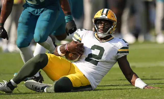 Green Bay Packers' Malik Willis runs for a first down during the second half of an NFL football game against the Jacksonville Jaguars Sunday, Oct. 27, 2024, in Jacksonville, Fla. (AP Photo/John Bazemore)