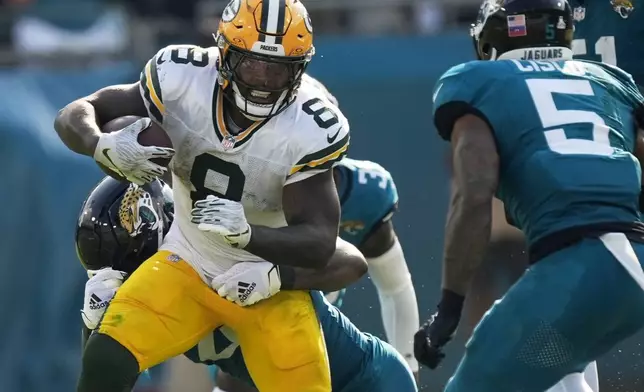 Green Bay Packers' Josh Jacobs runs during the second half of an NFL football game against the Jacksonville Jaguars Sunday, Oct. 27, 2024, in Jacksonville, Fla. (AP Photo/John Bazemore)