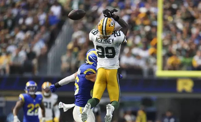 Green Bay Packers safety Xavier McKinney (29) attempts to intercept a pass during the second half of an NFL football game against the Los Angeles Rams Sunday, Oct. 6, 2024, in Inglewood, Calif. (AP Photo/Ryan Sun)